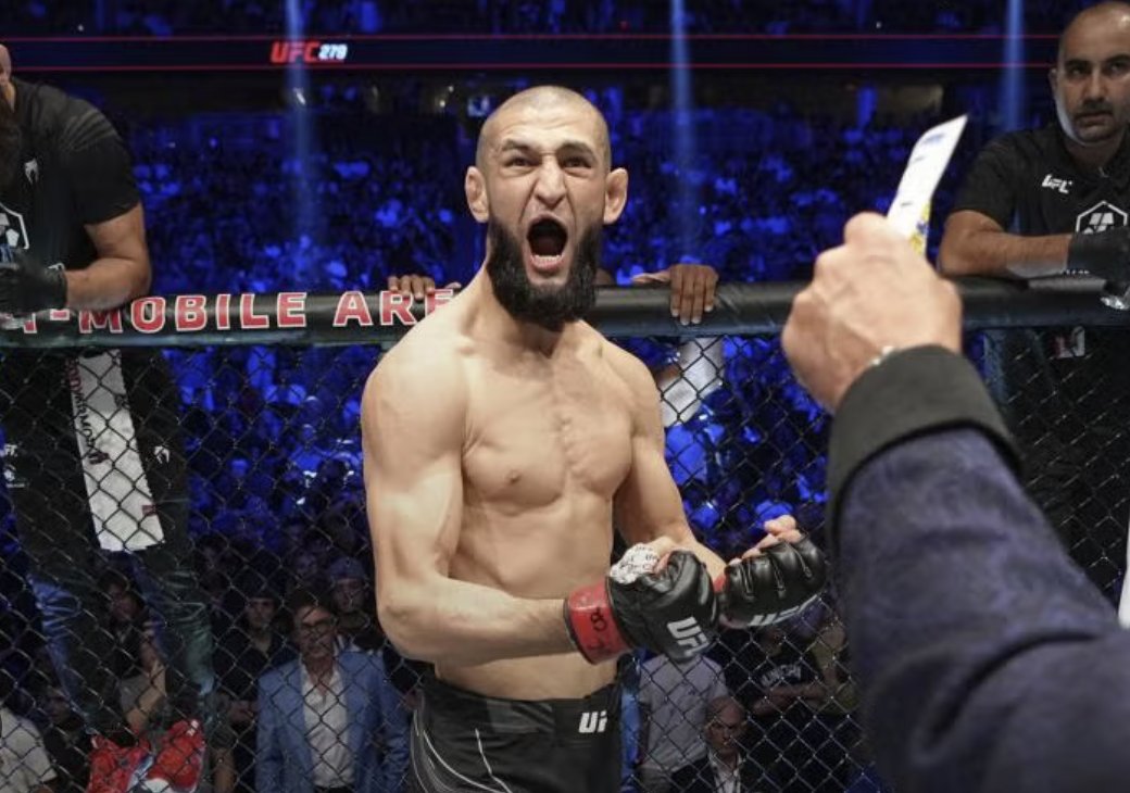 A fighter erupts as the judges' decision is read out — the moment a model's pre-fight number gets marked right or wrong